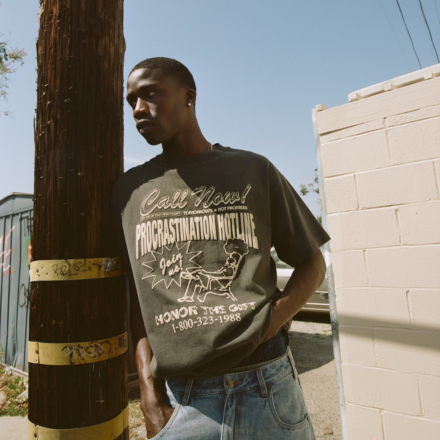 Procrastination Hotline Tee - Black