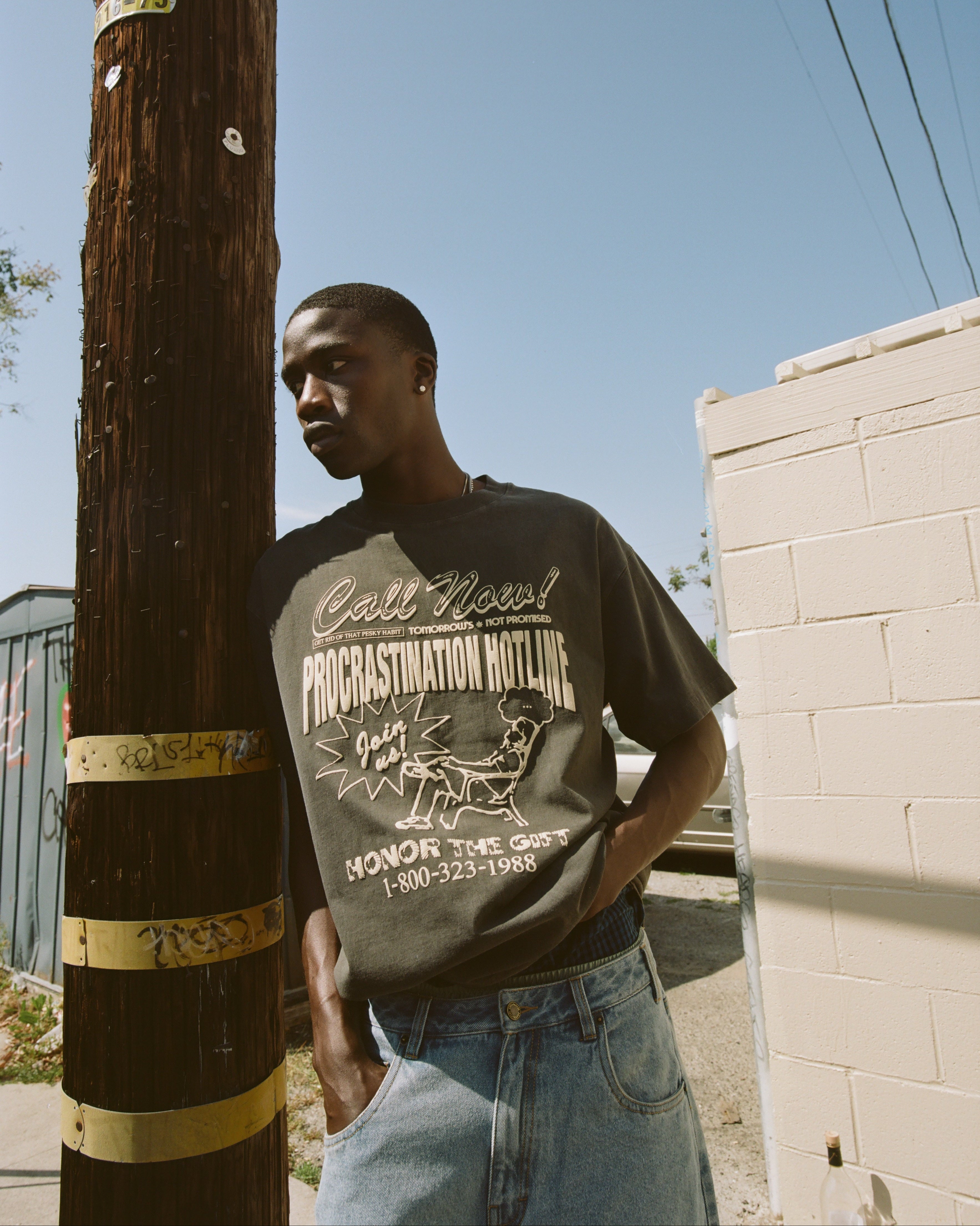 Procrastination Hotline Tee - Black